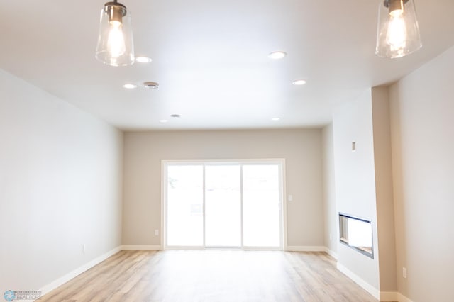 empty room with light hardwood / wood-style floors