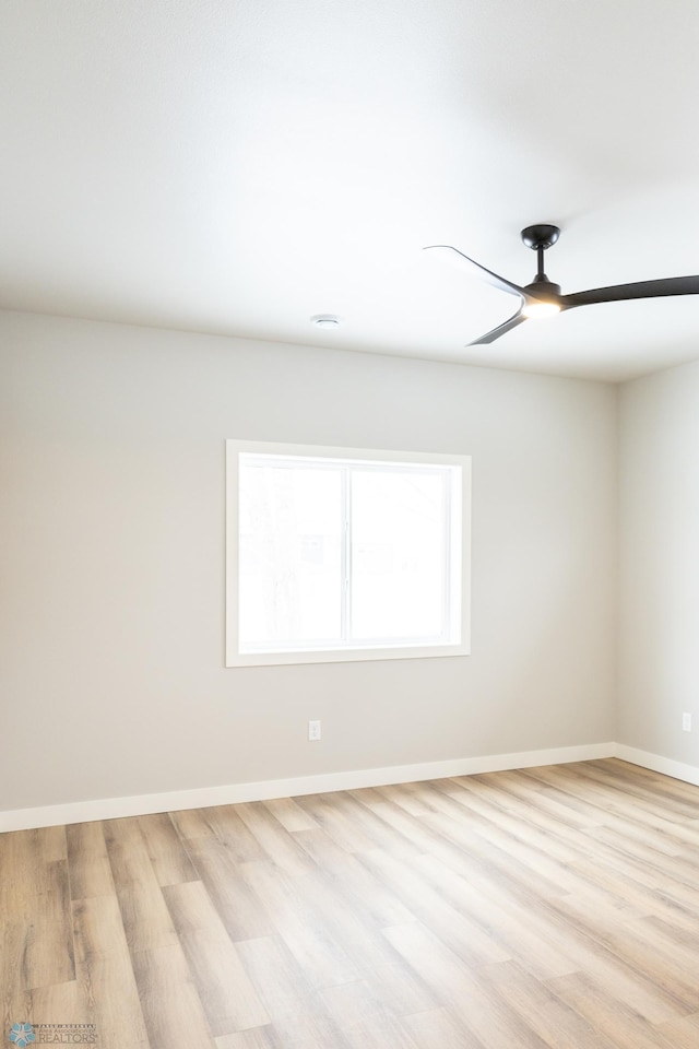 empty room with light wood-type flooring and ceiling fan