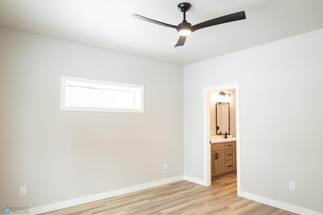 unfurnished bedroom featuring ensuite bathroom, ceiling fan, and light hardwood / wood-style floors