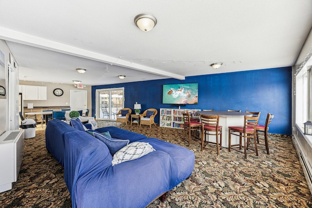 carpeted living room with beamed ceiling