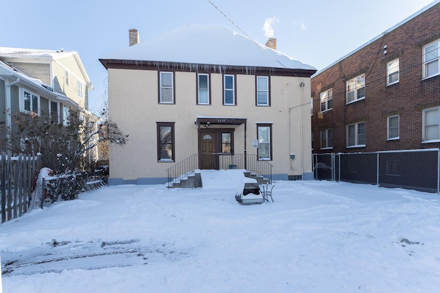 view of snow covered house