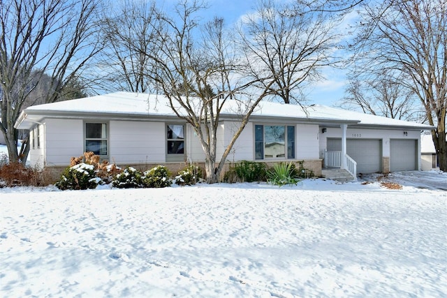 ranch-style house featuring a garage