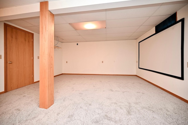 cinema featuring light carpet and a drop ceiling