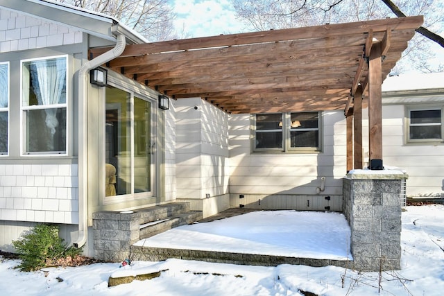 view of snow covered property entrance