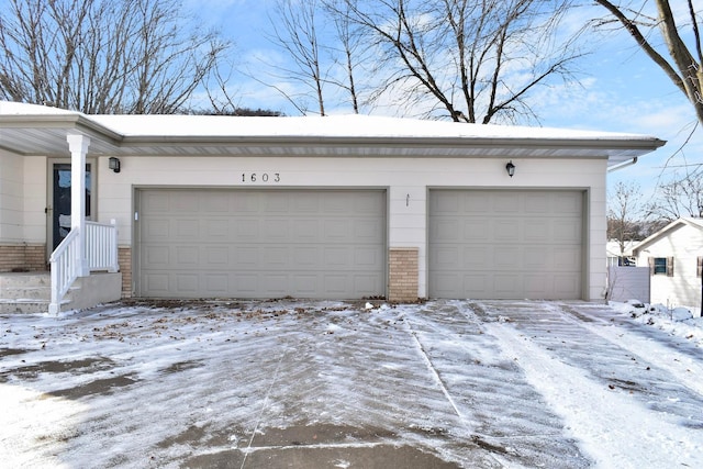 view of snow covered garage