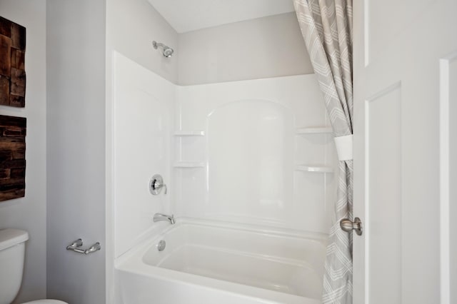 bathroom featuring toilet and shower / bathtub combination with curtain