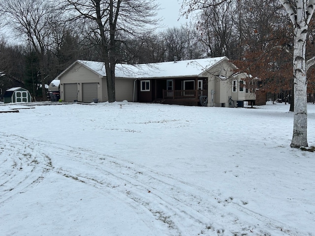 view of front of property with covered porch and an outdoor structure