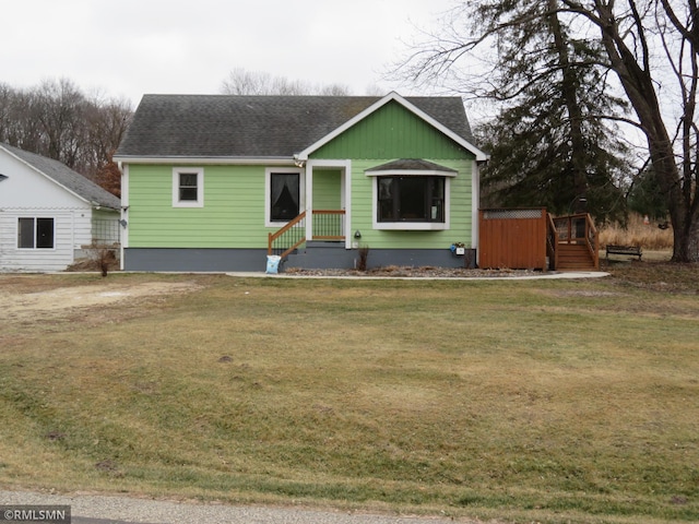 view of front of home featuring a front yard and a hot tub