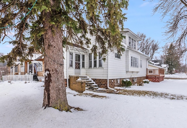 view of front of house with a wooden deck