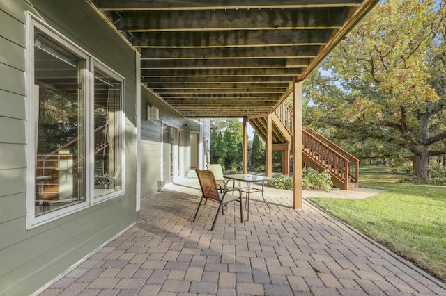 view of patio / terrace with stairs and outdoor dining area