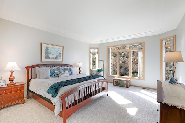 bedroom featuring carpet floors, visible vents, and baseboards