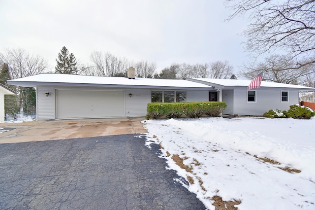 single story home with a garage