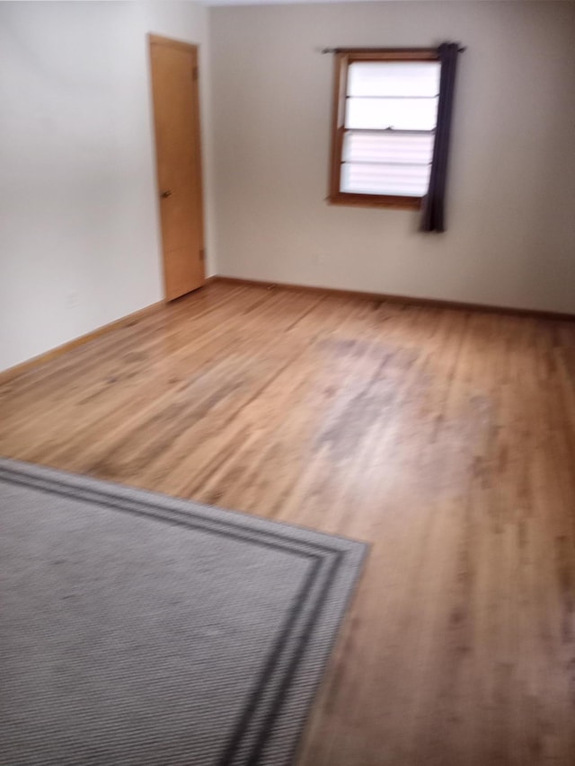 unfurnished room featuring wood-type flooring