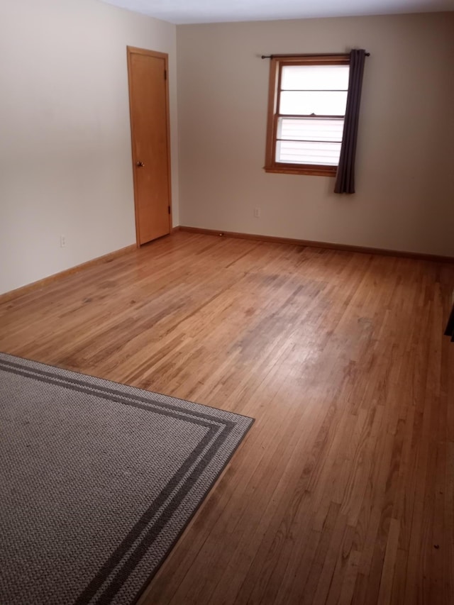 unfurnished room with light hardwood / wood-style flooring