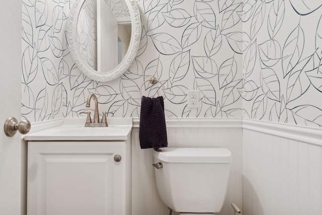 bathroom with toilet and vanity