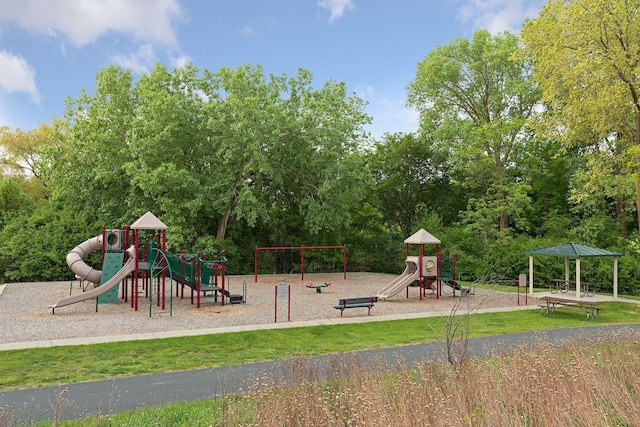 view of playground with a lawn