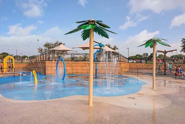 view of pool with a playground