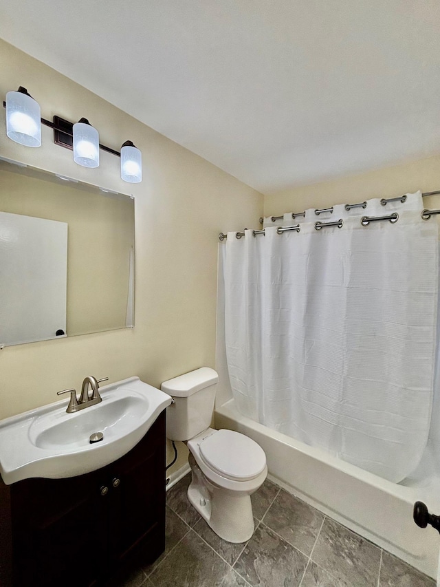 full bathroom with toilet, shower / bath combo with shower curtain, and vanity