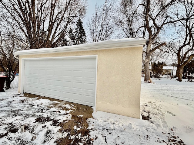 view of snow covered garage