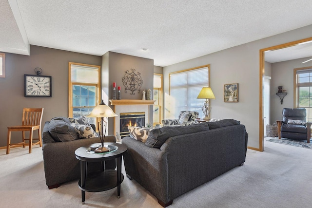 living room featuring light carpet and a textured ceiling