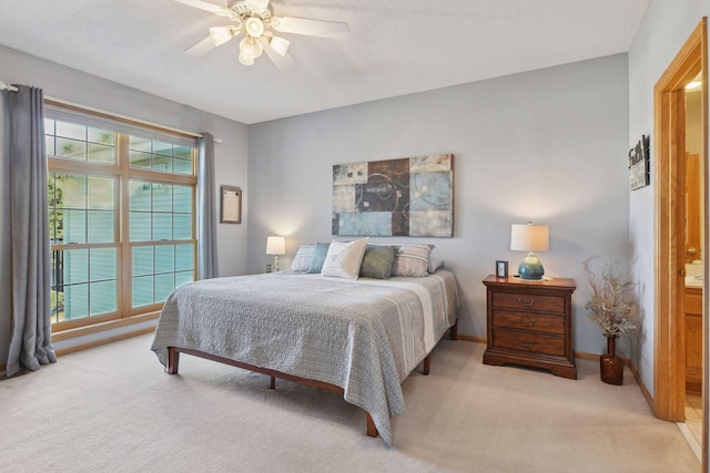 bedroom with light colored carpet and ceiling fan