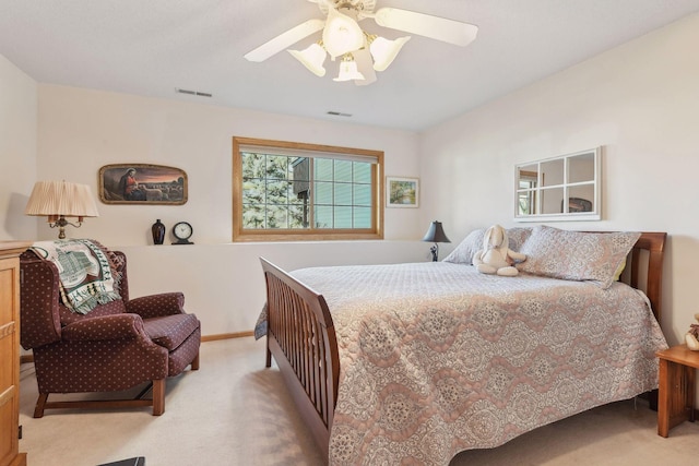 bedroom featuring light carpet and ceiling fan