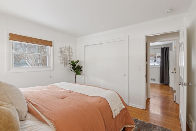 bedroom featuring a closet and light hardwood / wood-style floors