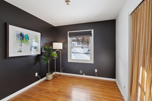 spare room featuring hardwood / wood-style floors