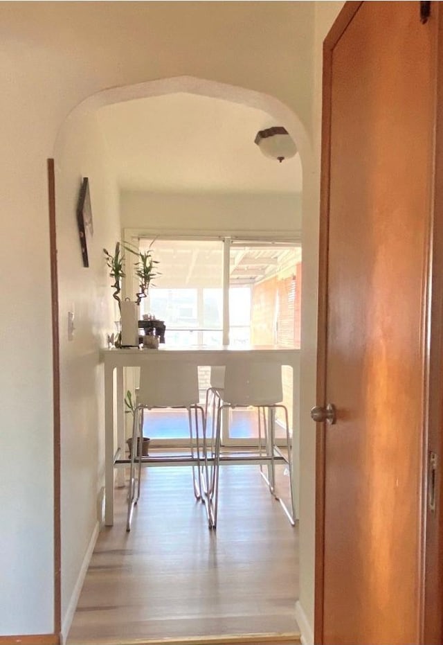 corridor with hardwood / wood-style floors