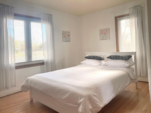 bedroom featuring wood-type flooring