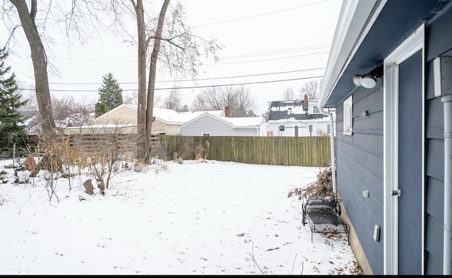 view of yard covered in snow