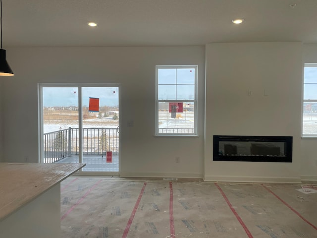 unfurnished living room with a wealth of natural light