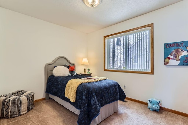 carpeted bedroom featuring a textured ceiling