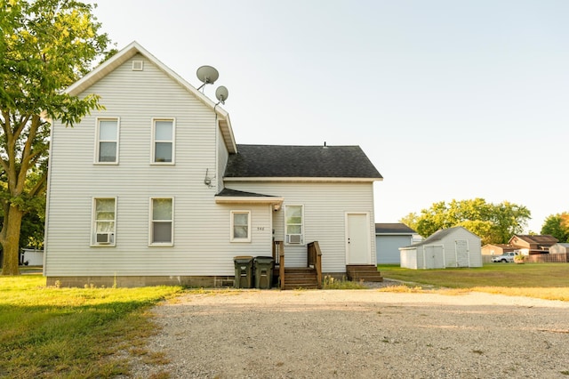 rear view of property featuring cooling unit