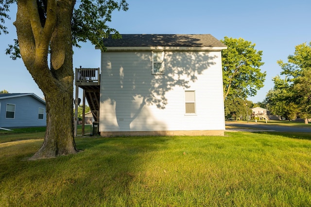 view of property exterior with a yard