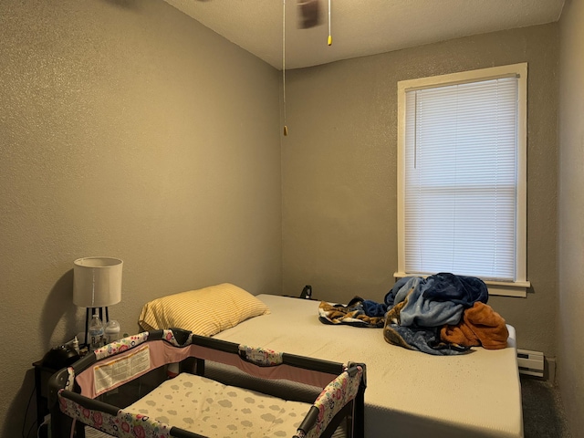 bedroom with a baseboard radiator