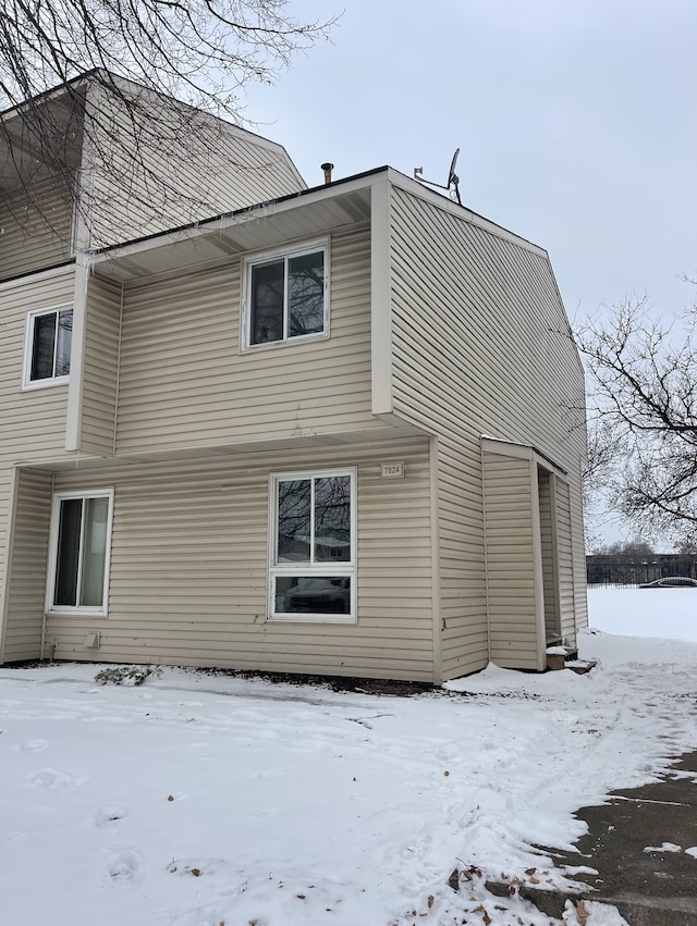 view of snow covered property