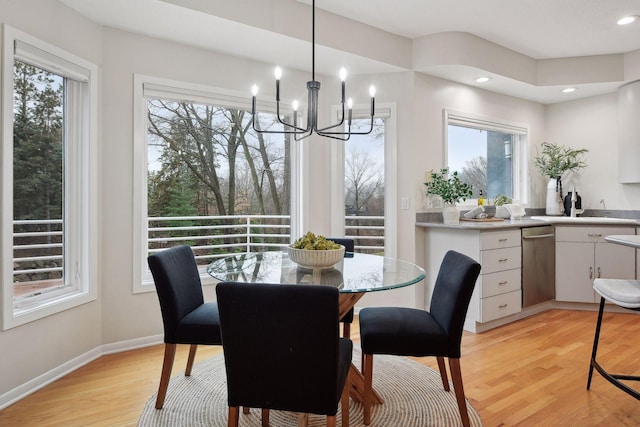 dining area featuring plenty of natural light and light hardwood / wood-style floors