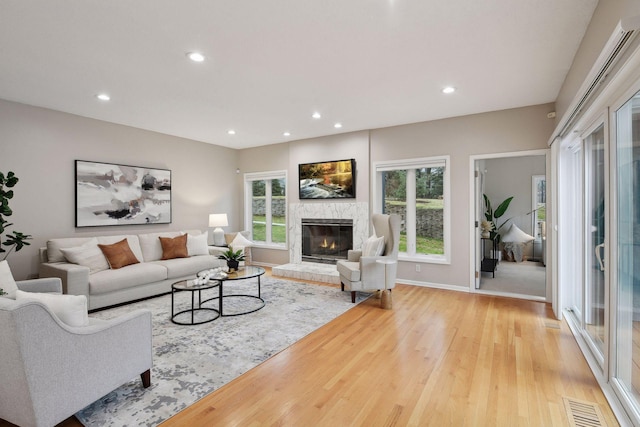 living room with plenty of natural light and light wood-type flooring