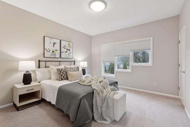 bedroom featuring light colored carpet