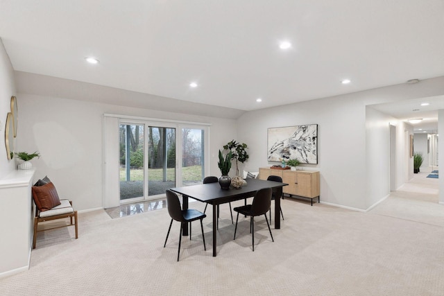 view of carpeted dining space