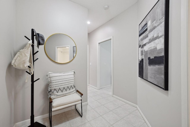 corridor with light tile patterned flooring