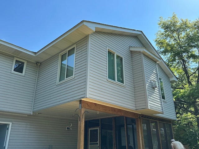 1028 241st Ave NE, East Bethel, MN 55005 - view of home's exterior featuring a sunroom
