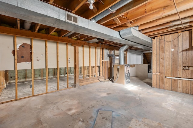 unfinished basement featuring visible vents