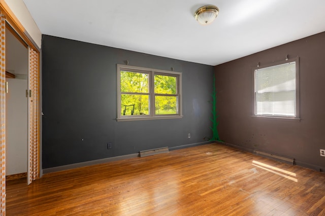 13749 County Road 116, Merrifield, MN 56465 - unfurnished bedroom with hardwood / wood-style floors and a closet