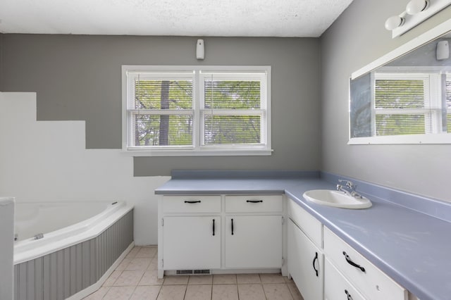 13749 County Road 116, Merrifield, MN 56465 - full bath featuring a bath, vanity, tile patterned floors, and a textured ceiling