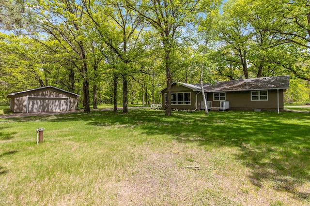 13749 County Road 116, Merrifield, MN 56465 - view of grassy yard featuring a garage and an outdoor structure