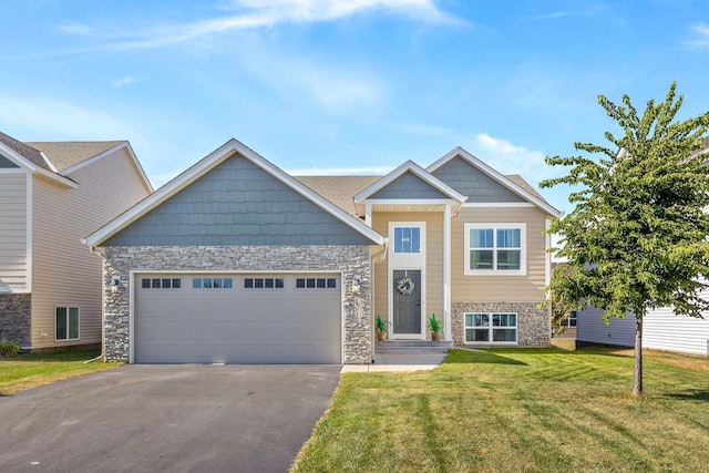 view of front of home featuring a front yard and a garage