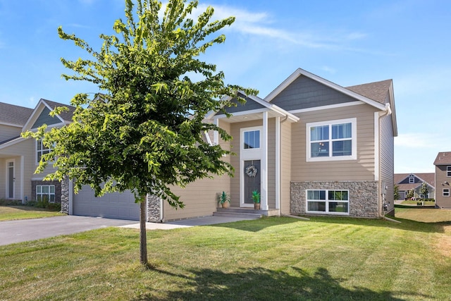 view of front of house featuring a front lawn and a garage