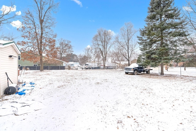 view of yard layered in snow